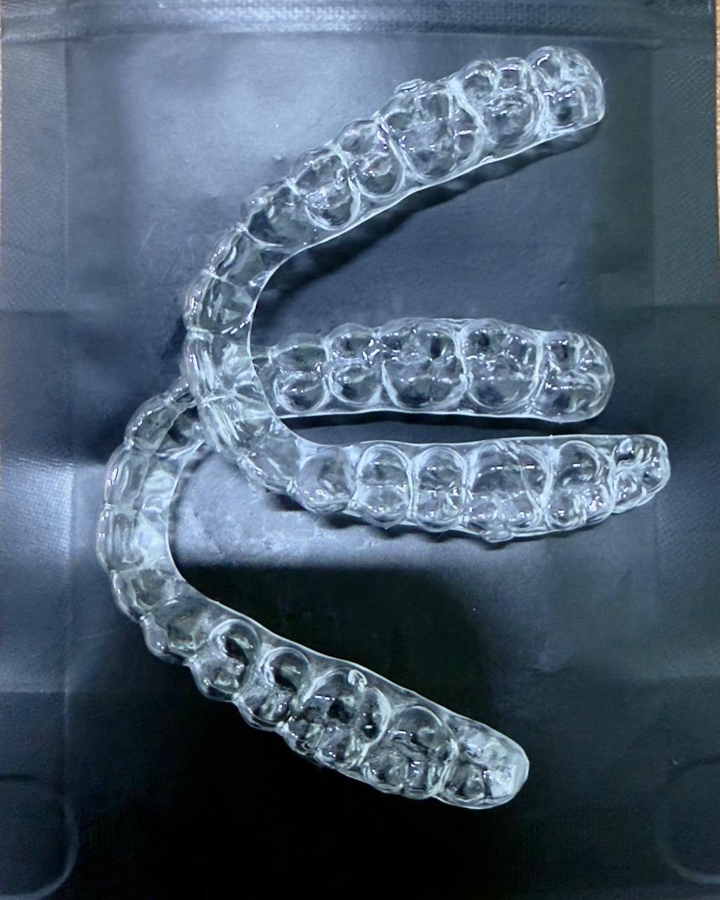 Clear aligners prepared for patient treatment.